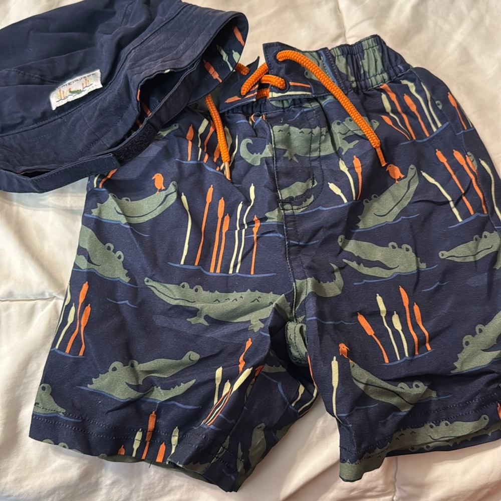 Super cute Janie & Jack swim trunks and sun hat. 0-6 months.